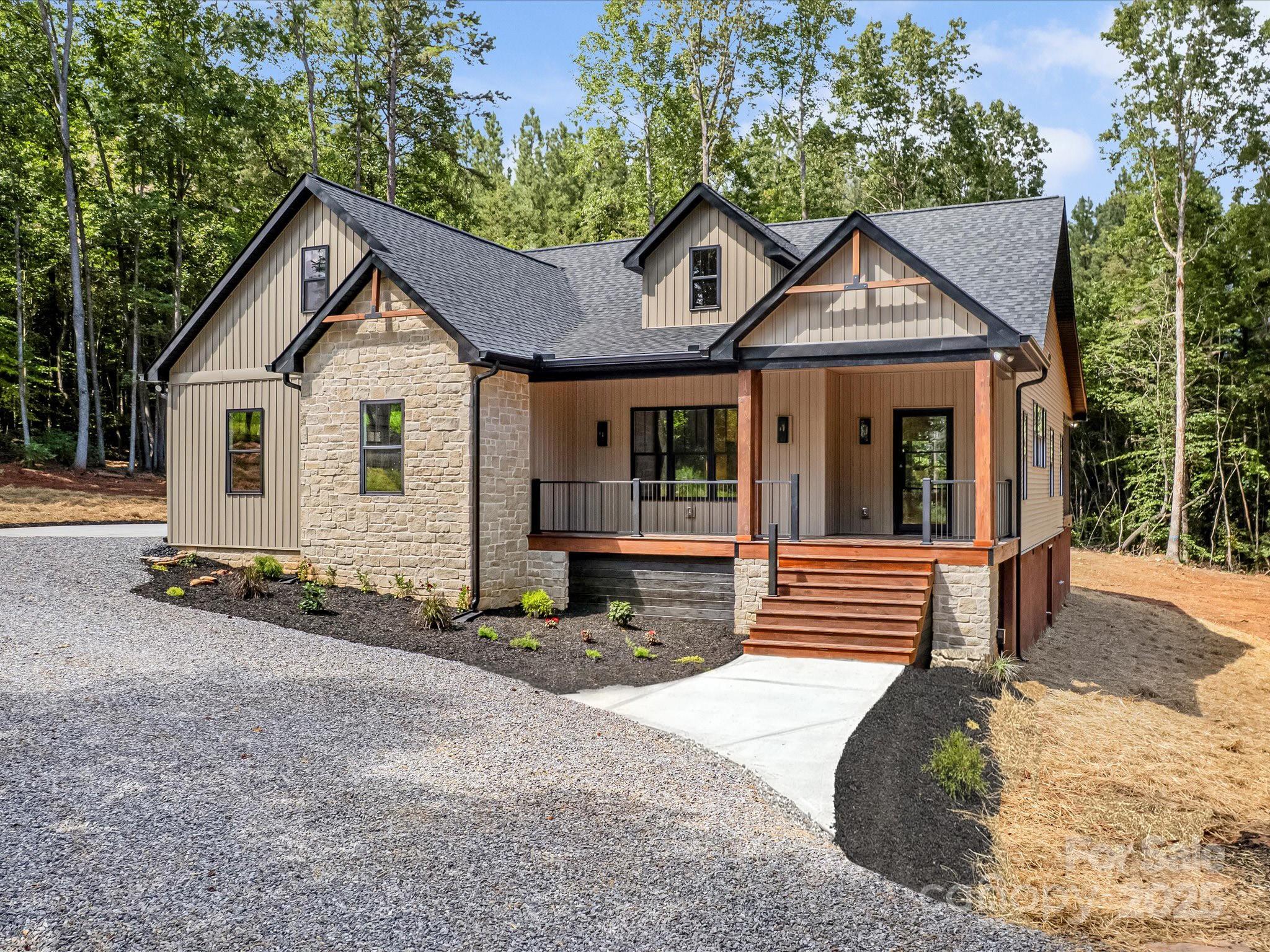 110 Rupard Road Statesville, NC 28625 - Photo 3 of 45 a front view of a house with a yard and garage
