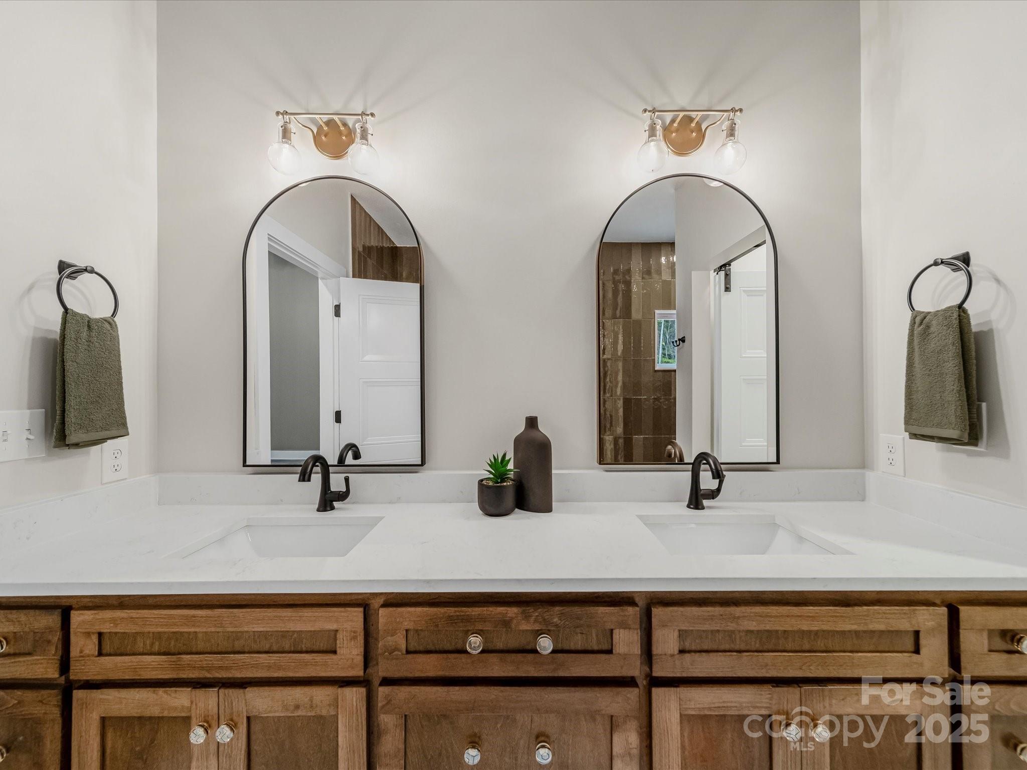 110 Rupard Road Statesville, NC 28625 - Photo 32 of 45 a bathroom with double vanity sinks and a mirror