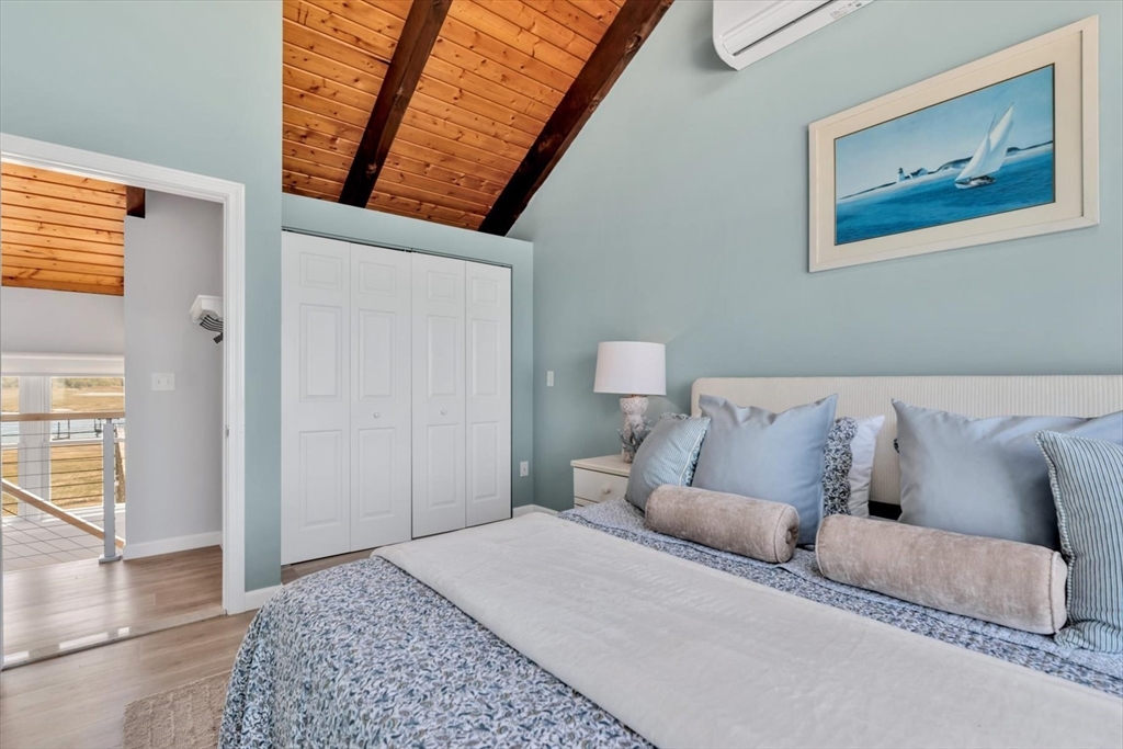 90 Salt Marsh Road East Sandwich, MA 02537 - Photo 30 of 40 a bed room with a bed and a couch