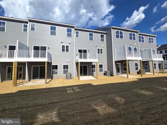 a front view of a house with large windows