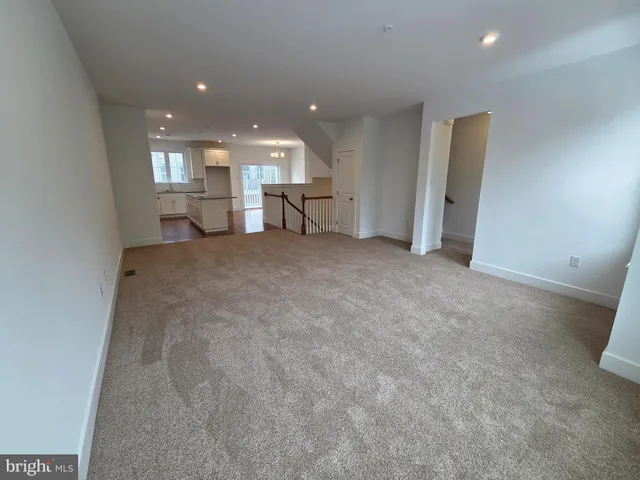 a view of a livingroom with furniture and an entrance
