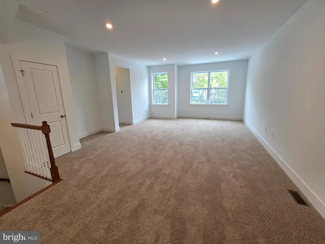 a view of an empty room and a window