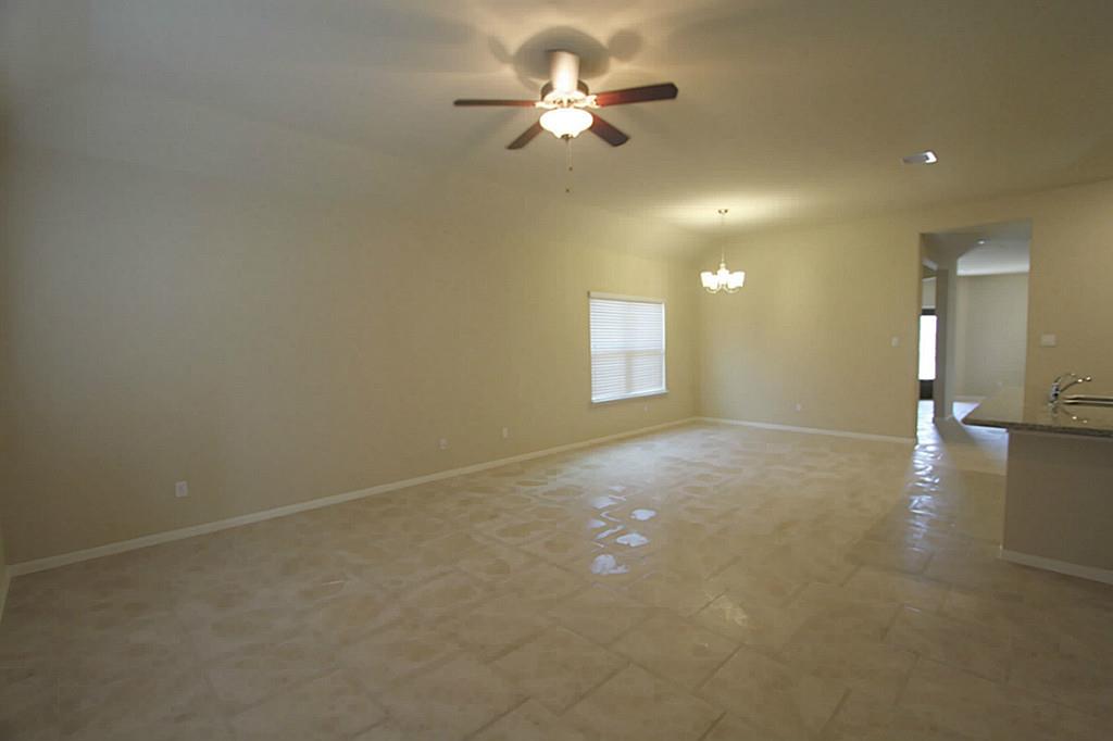 722 Mill Spring Court Rosenberg, TX 77469 - Photo 7 of 11 Family room and dining combination.