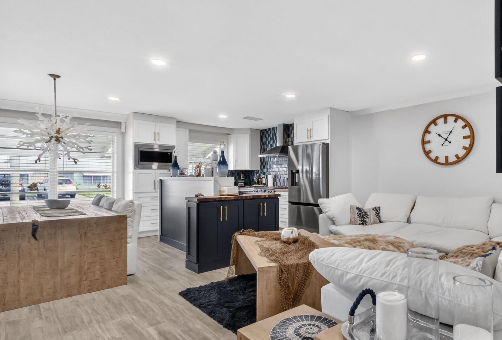 212 West High Point Terrace, Unit C Delray Beach, FL 33445 - Photo 14 of 35 a living room with furniture and kitchen view