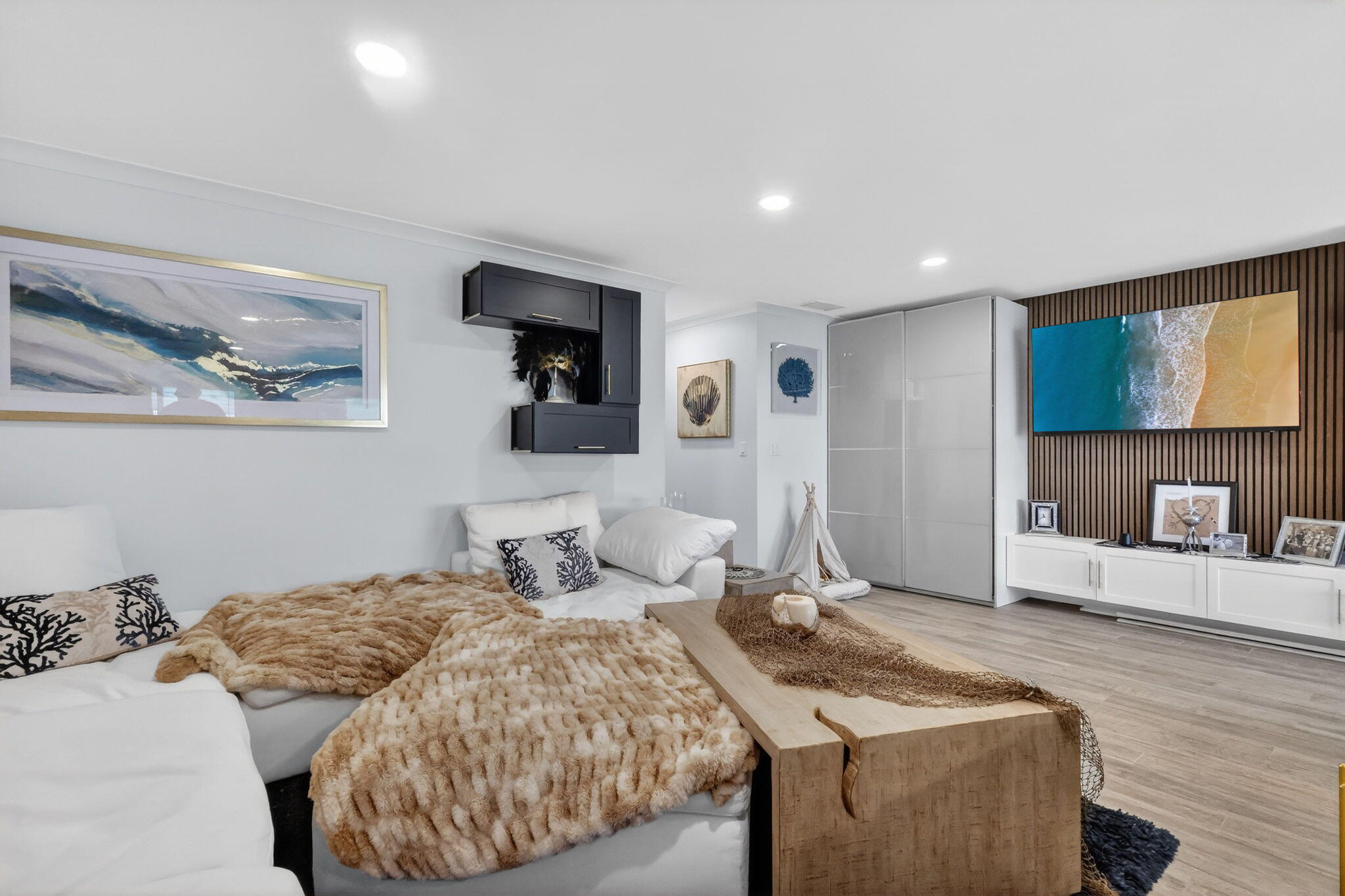 212 West High Point Terrace, Unit C Delray Beach, FL 33445 - Photo 15 of 35 a bedroom with a bed and a flat screen tv