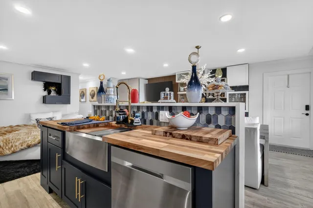 a kitchen with a sink and cabinets