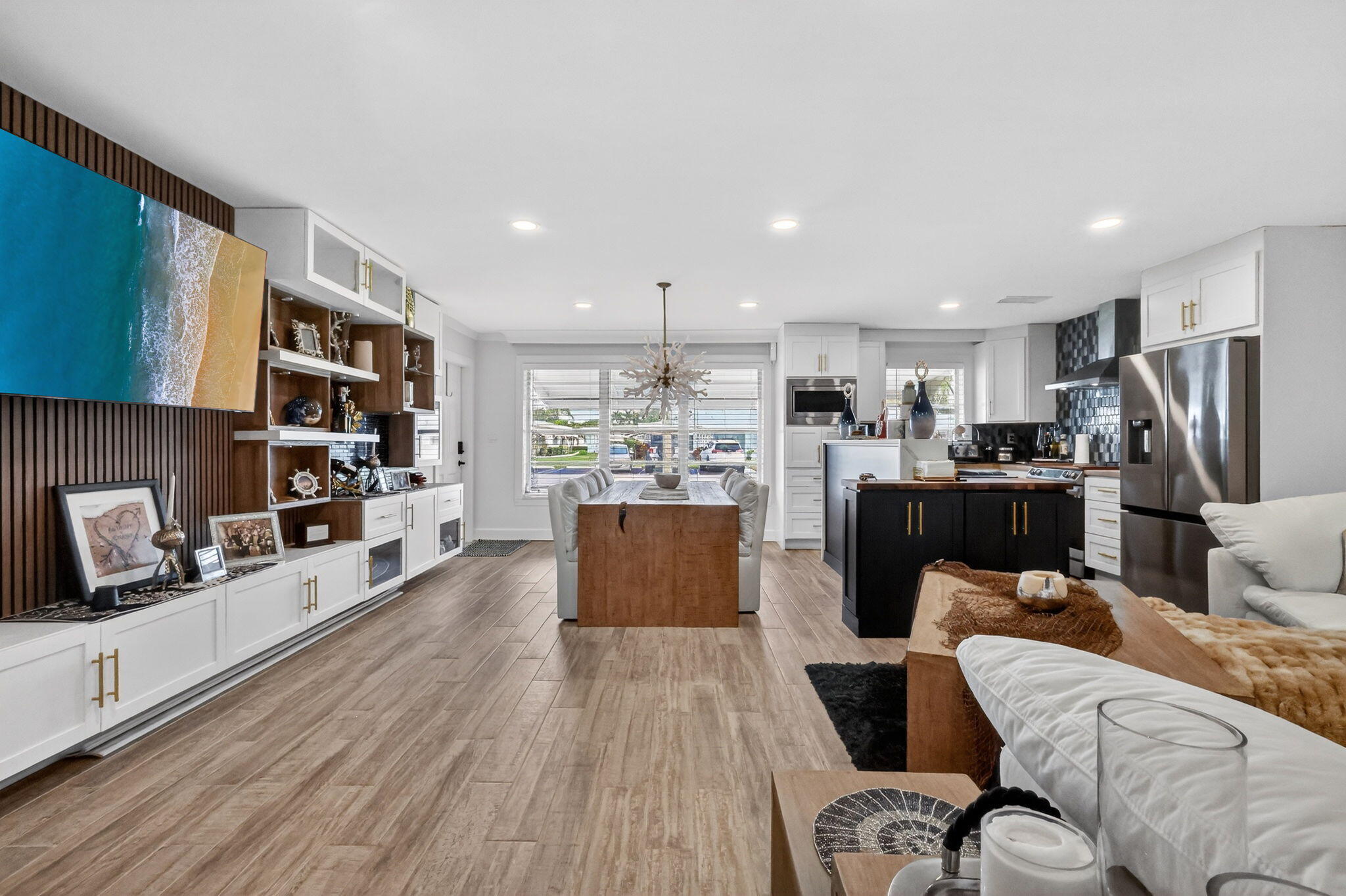 212 West High Point Terrace, Unit C Delray Beach, FL 33445 - Photo 20 of 35 a living room with furniture and a wooden floor