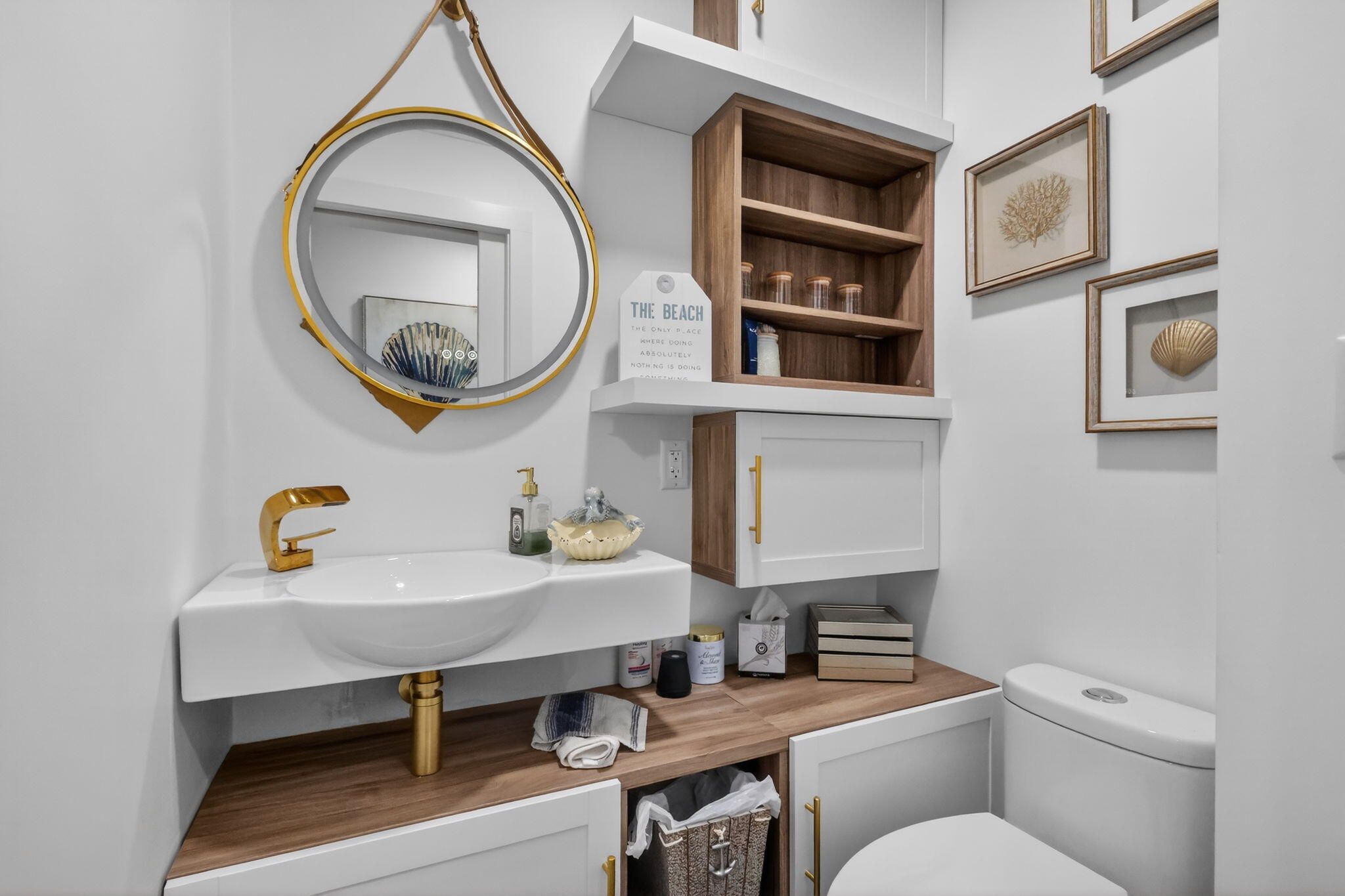 212 West High Point Terrace, Unit C Delray Beach, FL 33445 - Photo 21 of 35 a bathroom with a toilet a sink and a mirror