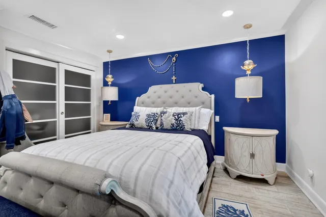 a bedroom with a bed and a television