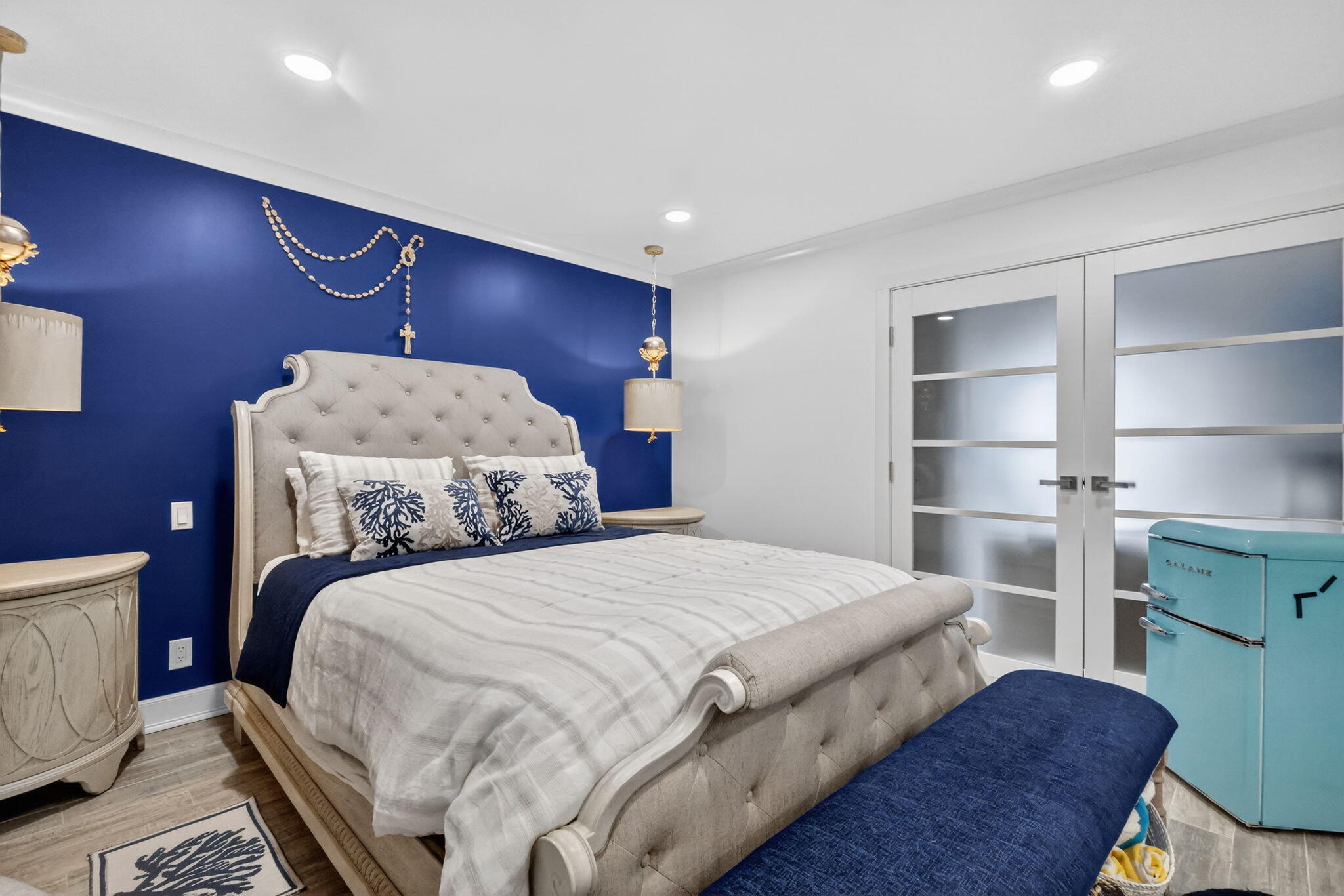 212 West High Point Terrace, Unit C Delray Beach, FL 33445 - Photo 25 of 35 a bedroom with a bed and a cabinets