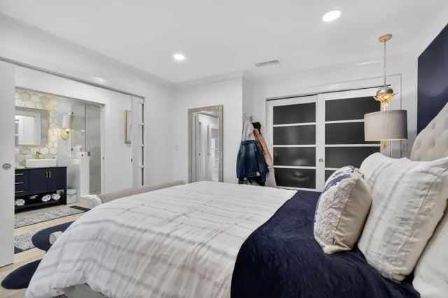 a bedroom with a bed and a television