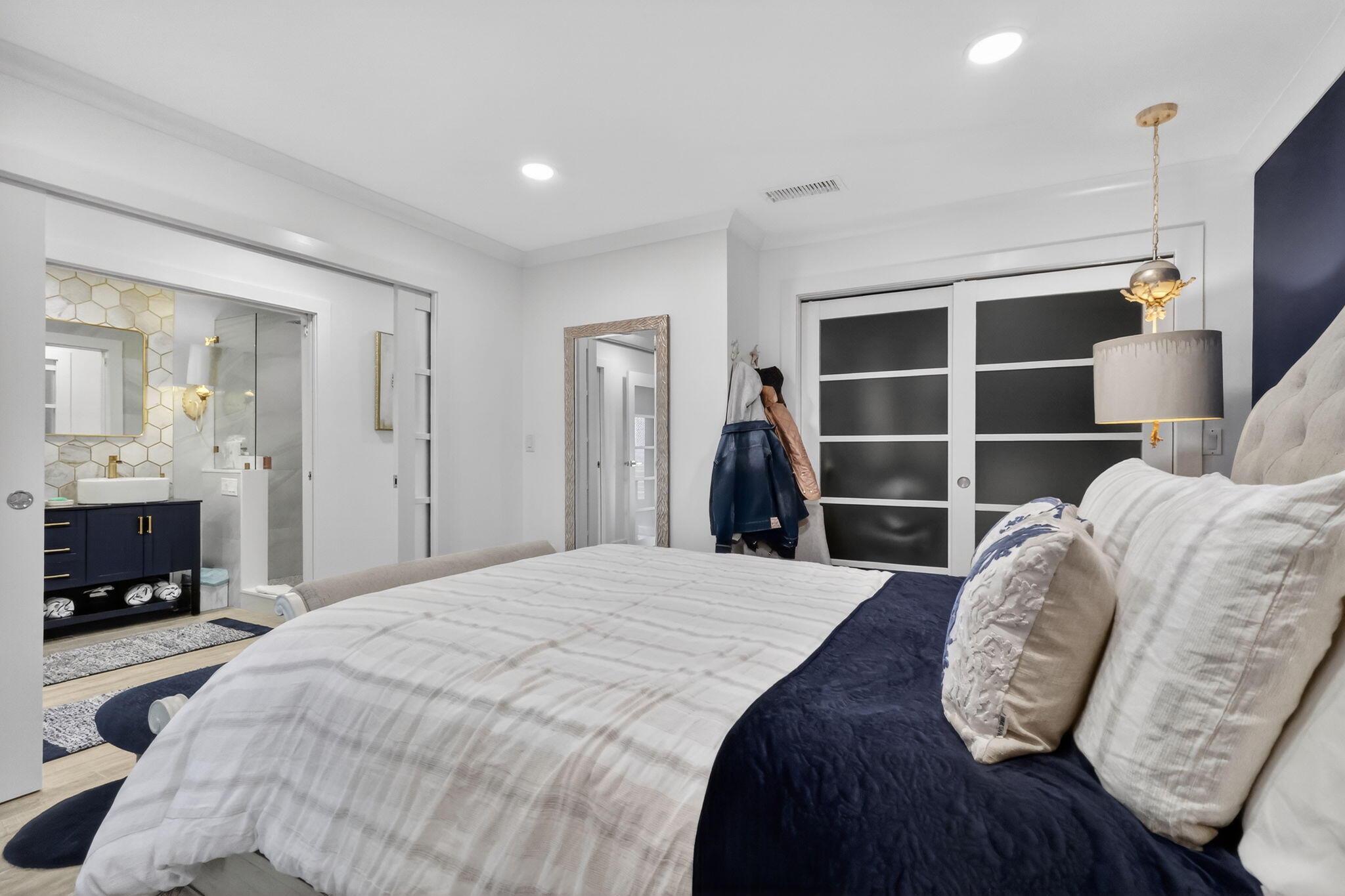 212 West High Point Terrace, Unit C Delray Beach, FL 33445 - Photo 26 of 35 a bedroom with a bed and a television