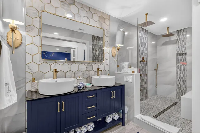 a bathroom with a sink double vanity and a mirror