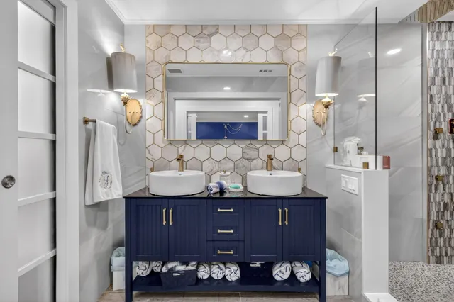 a bathroom with a sink double vanity and a mirror
