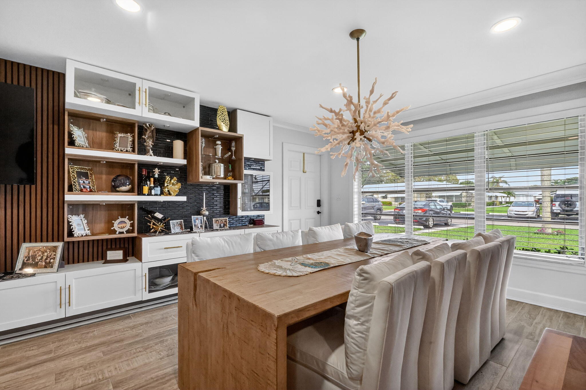 212 West High Point Terrace, Unit C Delray Beach, FL 33445 - Photo 3 of 35 a view of a dining room with furniture and window