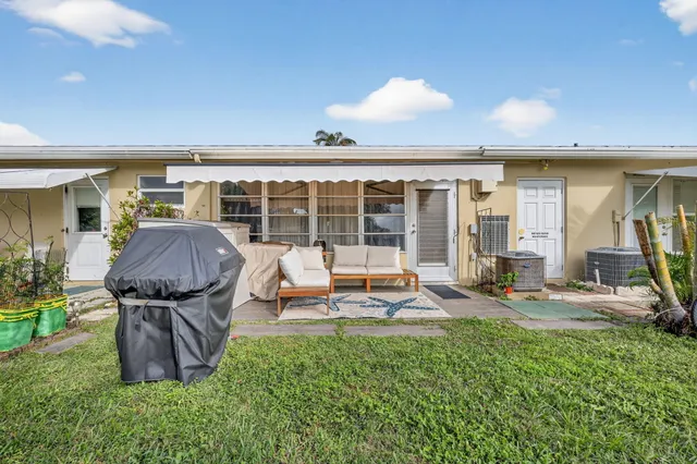a view of a house with backyard porch and patio