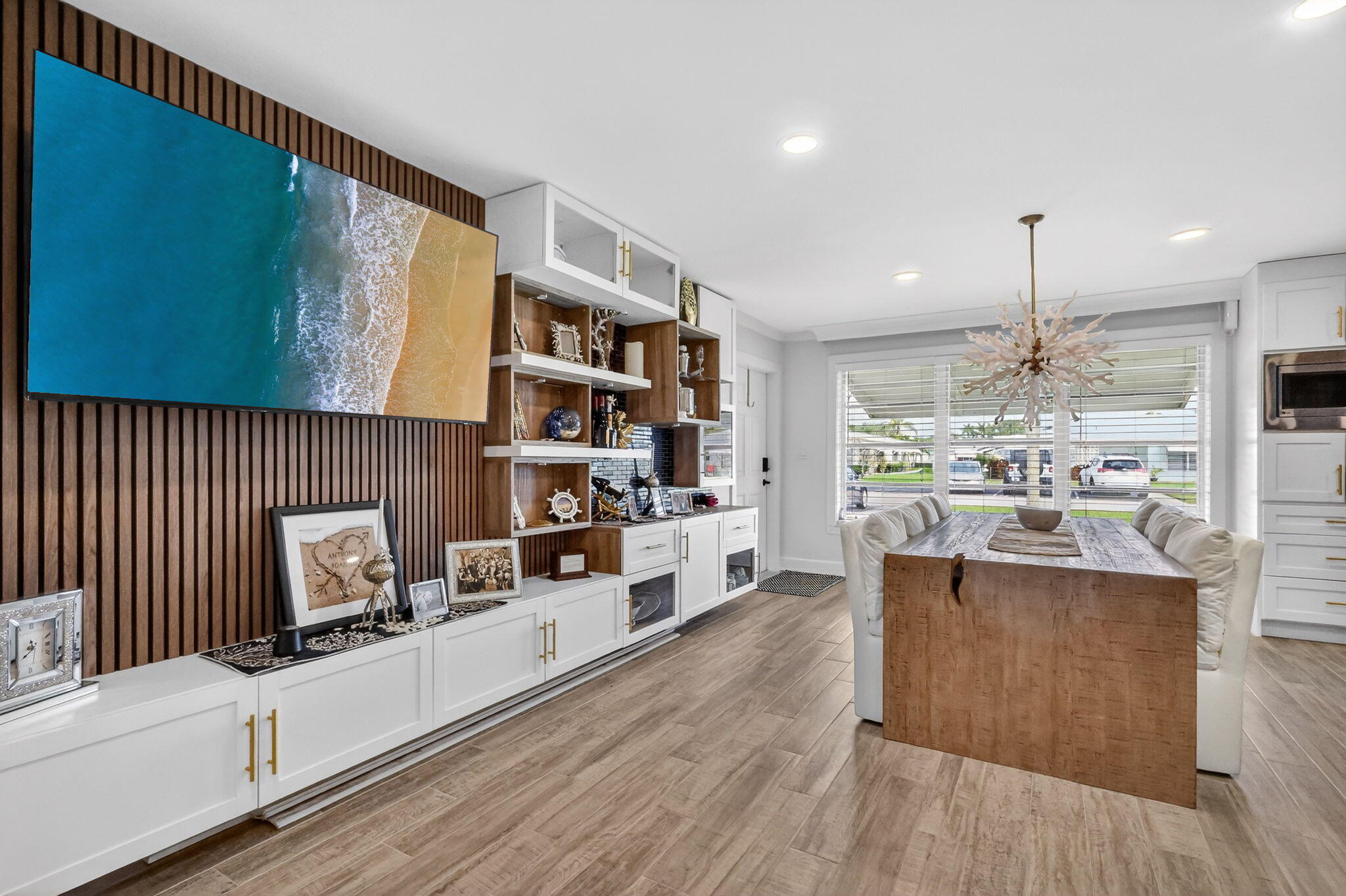 212 West High Point Terrace, Unit C Delray Beach, FL 33445 - Photo 35 of 35 a kitchen with stainless steel appliances kitchen island granite countertop a stove and a wooden floors
