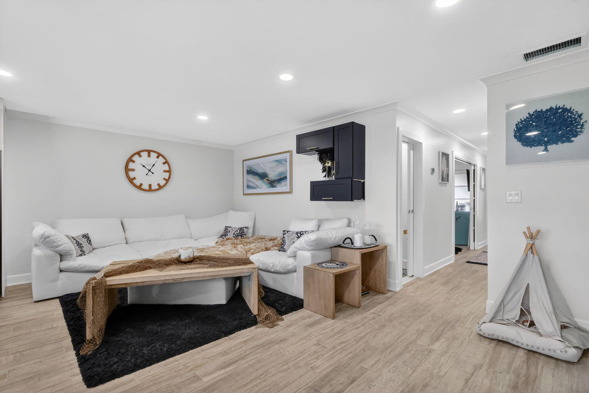 212 West High Point Terrace, Unit C Delray Beach, FL 33445 - Photo 7 of 35 a living room with furniture a wooden floor and next to a window