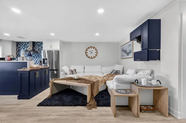 a living room with dining table and chairs