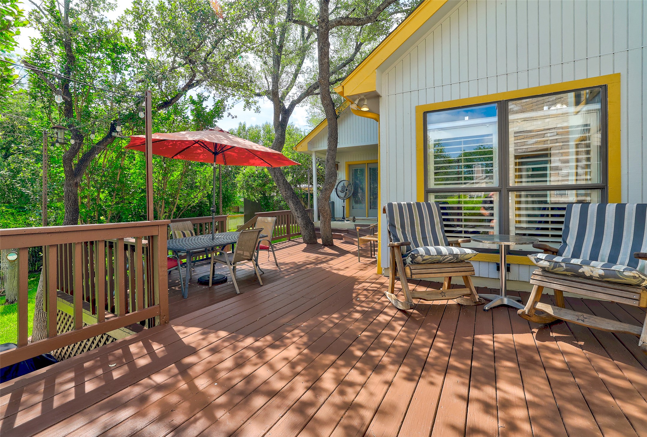 110 South Ridge Circle Georgetown, TX 78628 - Photo 31 of 37 Expansive wood-finish deck with a wood railing and mature trees