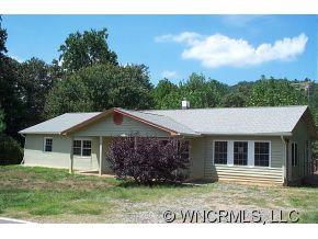 100 Union Chapel Road Weaverville, NC 28787 - Photo 2 of 12 a front view of a house with a garden