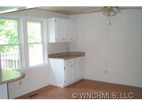 100 Union Chapel Road Weaverville, NC 28787 - Photo 4 of 12 a kitchen with a sink cabinets and a window