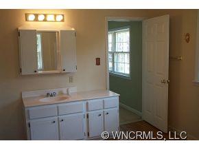 100 Union Chapel Road Weaverville, NC 28787 - Photo 6 of 12 a bathroom with a sink vanity and mirror