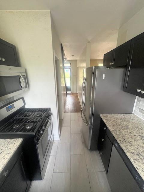 358 Pointview Road Pittsburgh, PA 15227 - Photo 4 of 12 a kitchen that has a sink a refrigerator and a stove