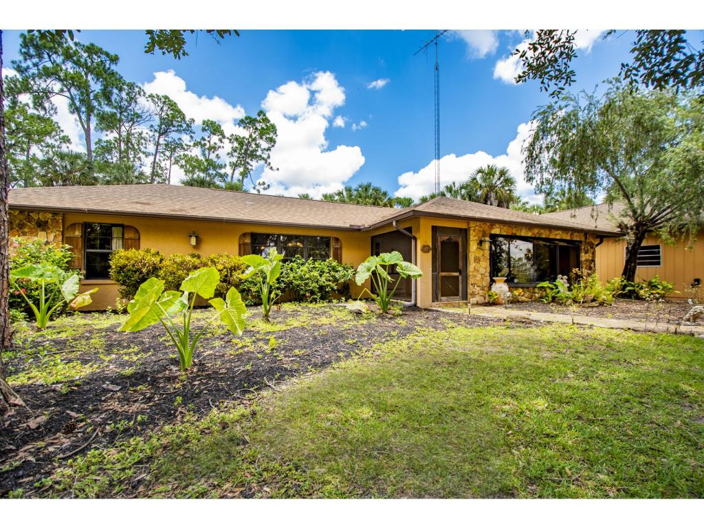 4125 13th Avenue Southwest Naples, FL 34116 - Photo 2 of 34 a view of a house with swimming pool