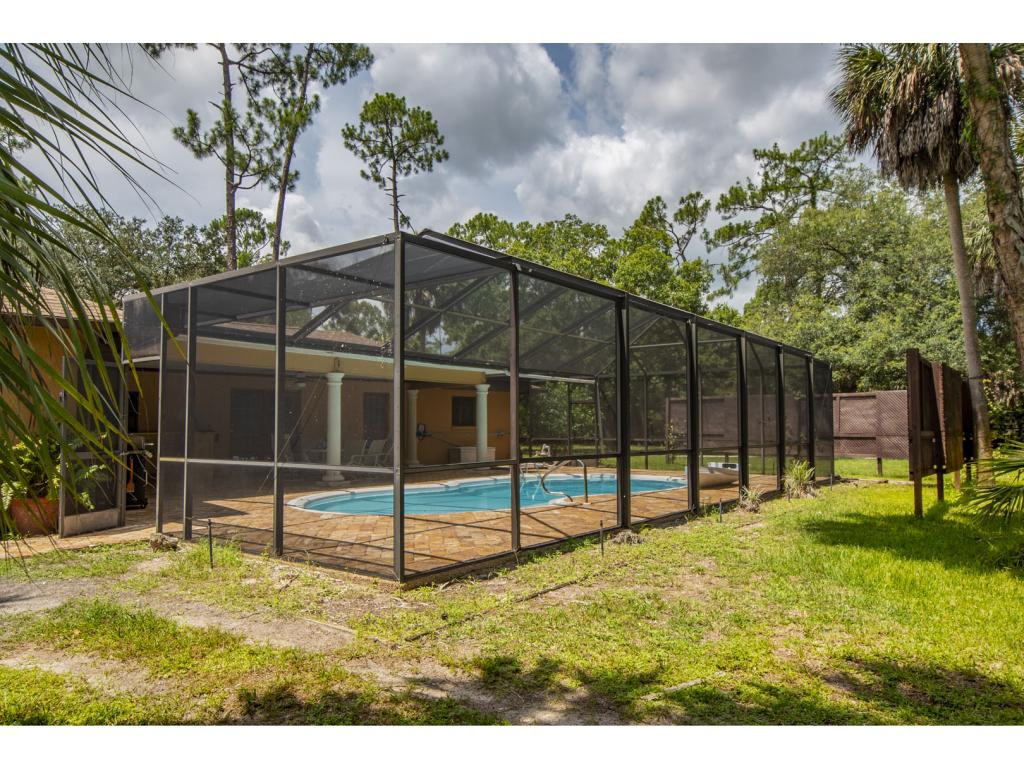 4125 13th Avenue Southwest Naples, FL 34116 - Photo 14 of 34 a view of a backyard