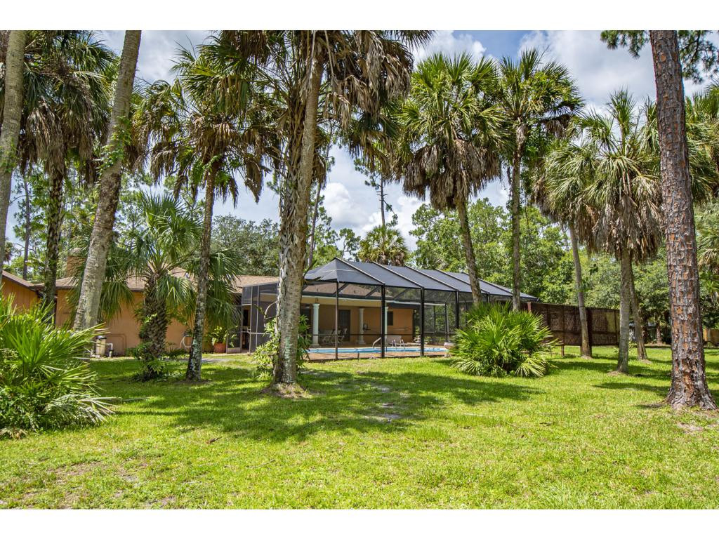 4125 13th Avenue Southwest Naples, FL 34116 - Photo 15 of 34 a view of a house with a yard