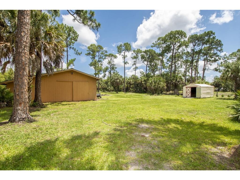 4125 13th Avenue Southwest Naples, FL 34116 - Photo 19 of 34 a view of a house with a yard