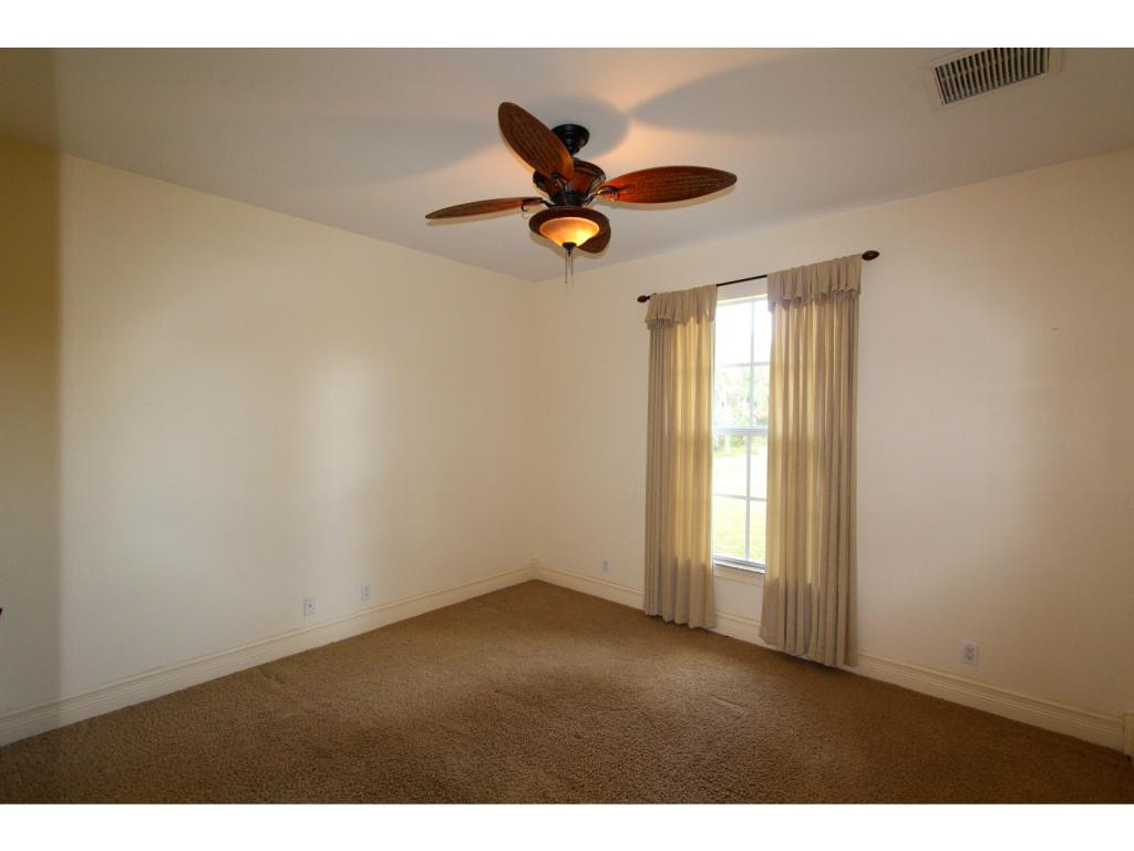 4125 13th Avenue Southwest Naples, FL 34116 - Photo 26 of 34 a view of an empty room and window