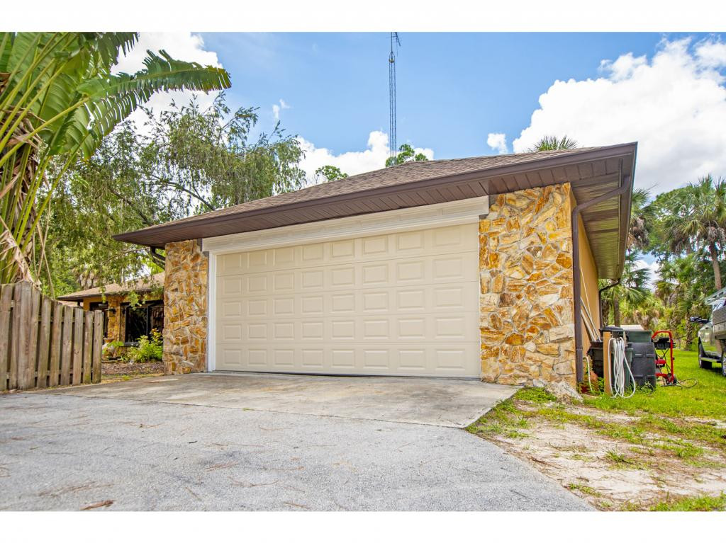 4125 13th Avenue Southwest Naples, FL 34116 - Photo 28 of 34 a front view of house with an outdoor space