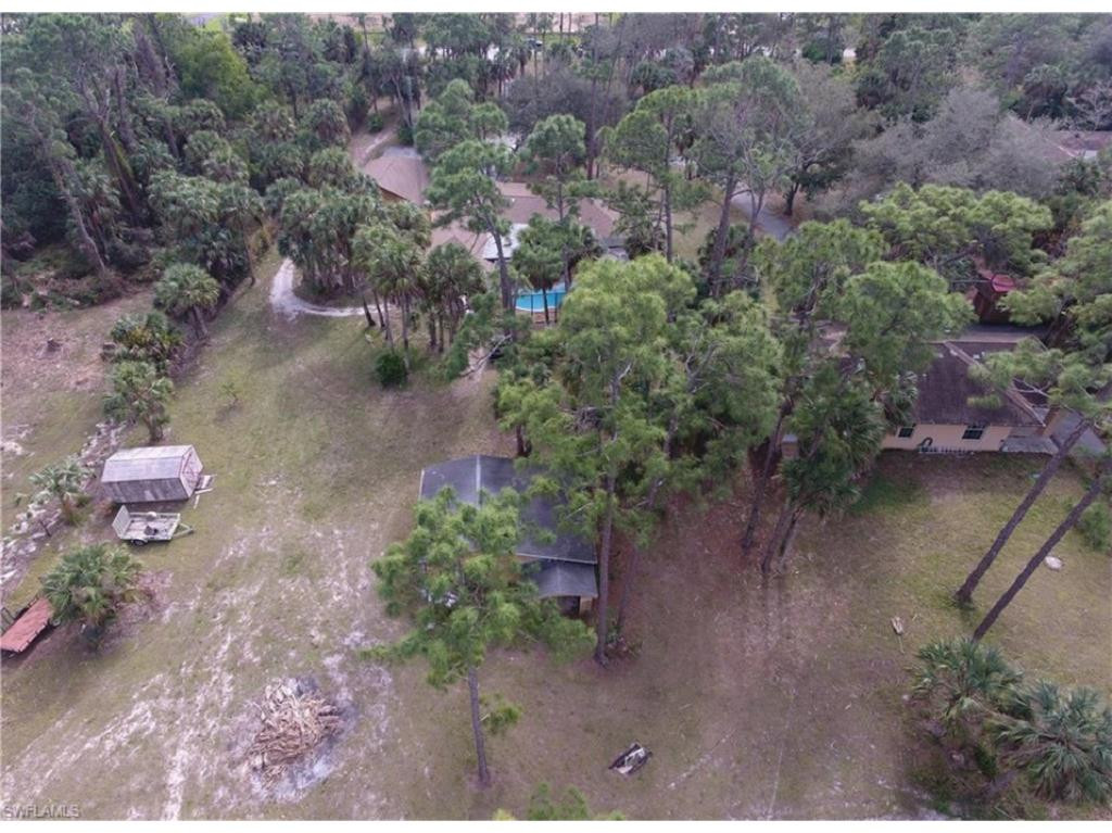 4125 13th Avenue Southwest Naples, FL 34116 - Photo 33 of 34 an aerial view of a house with a yard