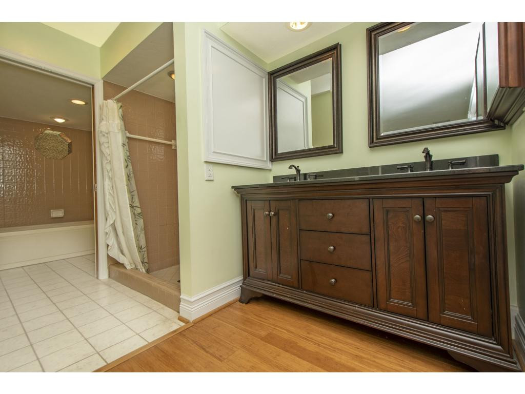 4125 13th Avenue Southwest Naples, FL 34116 - Photo 9 of 34 a bathroom with a sink and a mirror