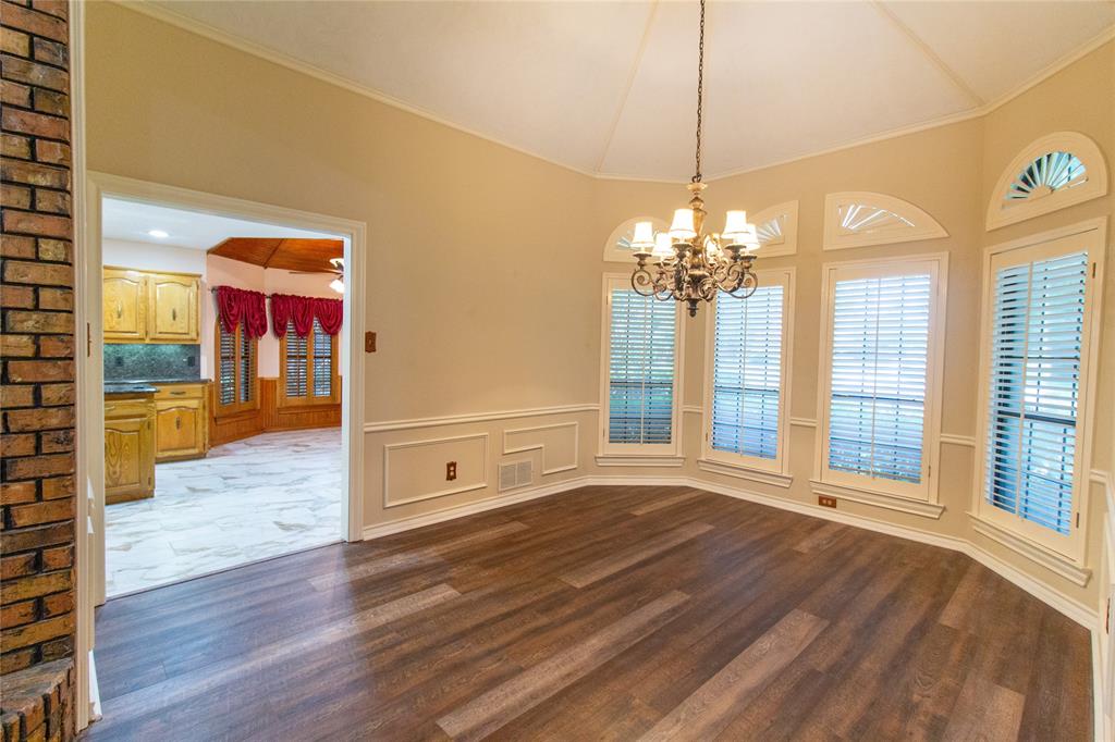 3014 Pecan Ridge Drive Rowlett, TX 75088 - Photo 9 of 29 a view of a room with wooden floor and chandelier