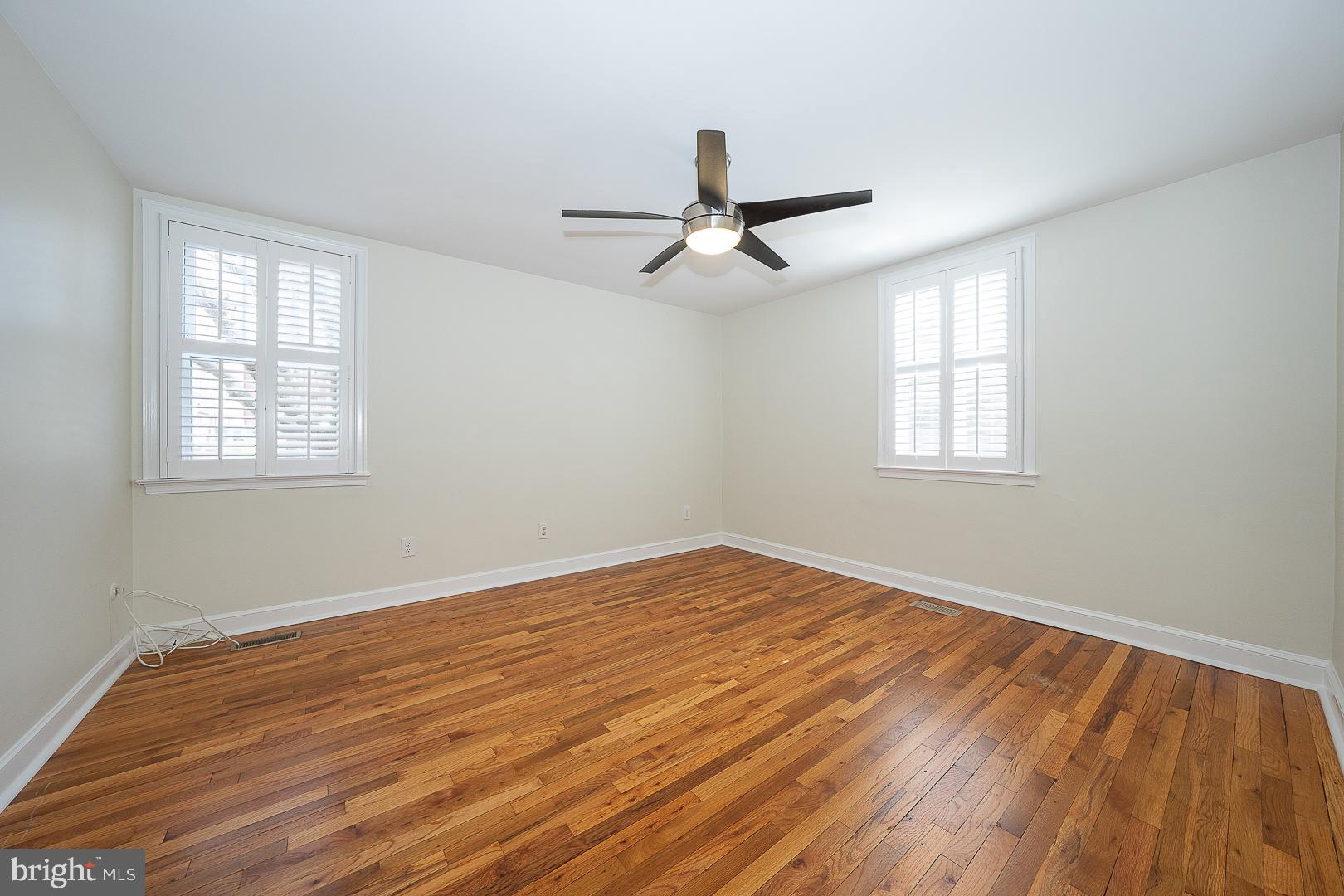 500 East Lancaster Avenue, Unit 111A Wayne, PA 19087 - Photo 17 of 43 a view of empty room with wooden floor and fan