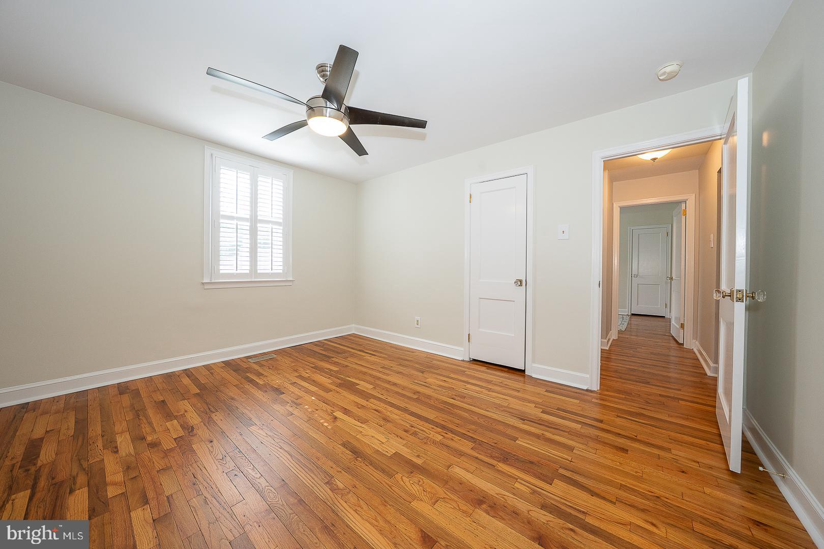 500 East Lancaster Avenue, Unit 111A Wayne, PA 19087 - Photo 18 of 43 a view of an empty room with wooden floor and a window