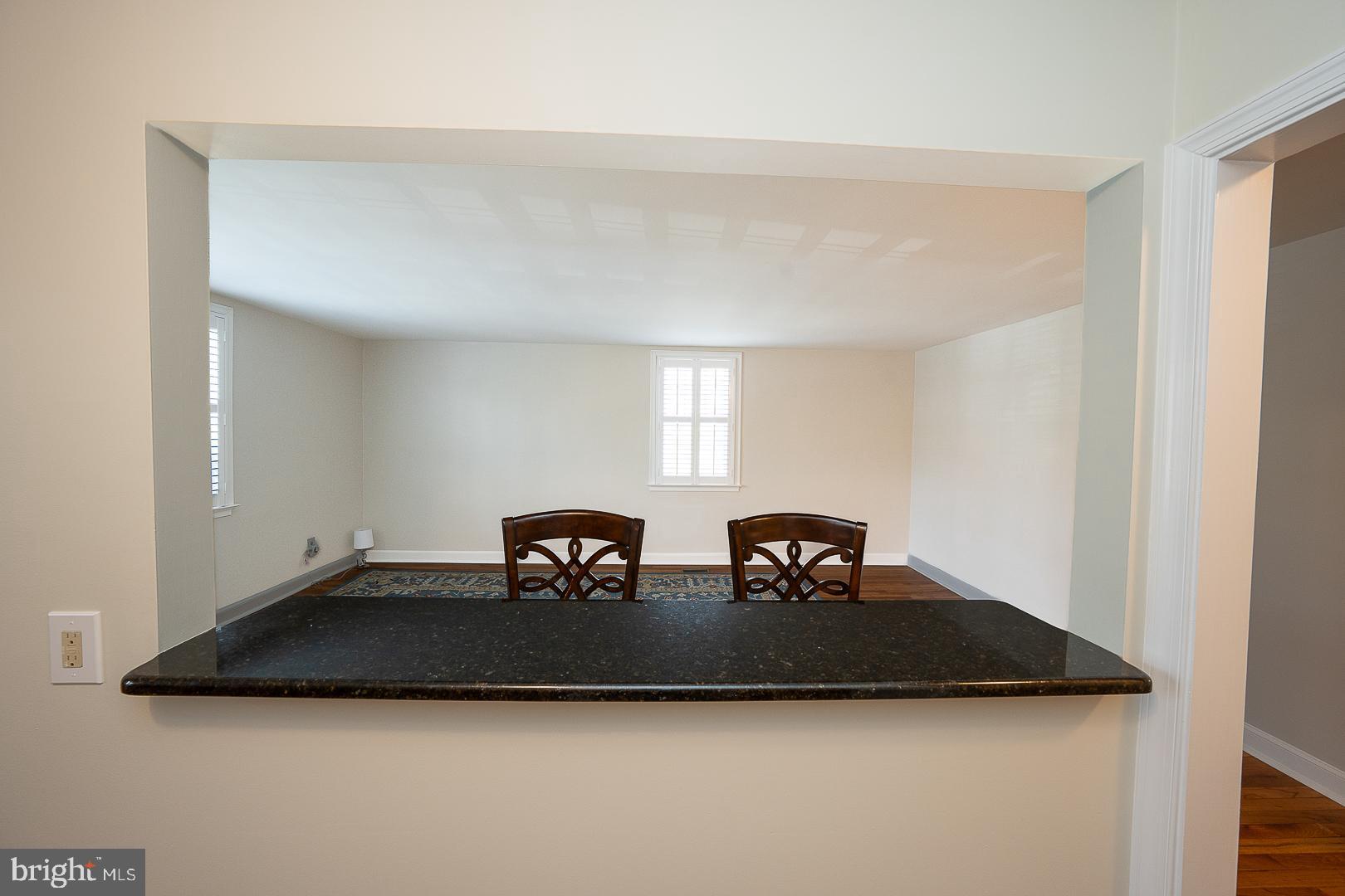500 East Lancaster Avenue, Unit 111A Wayne, PA 19087 - Photo 9 of 43 a living room with two couches and a table with wooden floor