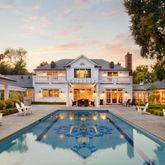 a swimming pool view with a outdoor seating space