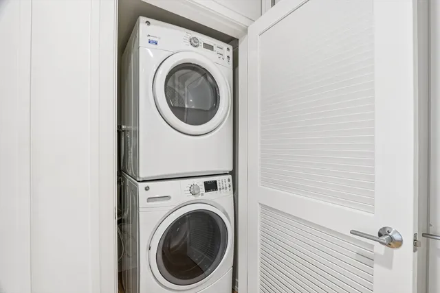 a view of a hallway with washer and dryer