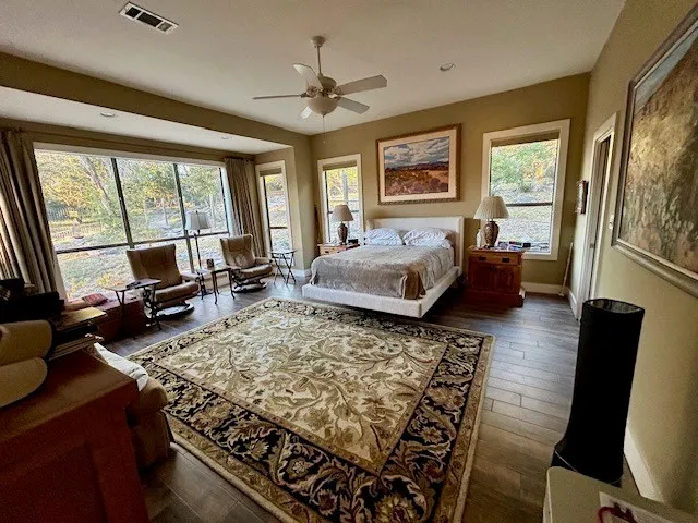 a bedroom with a bed furniture and window