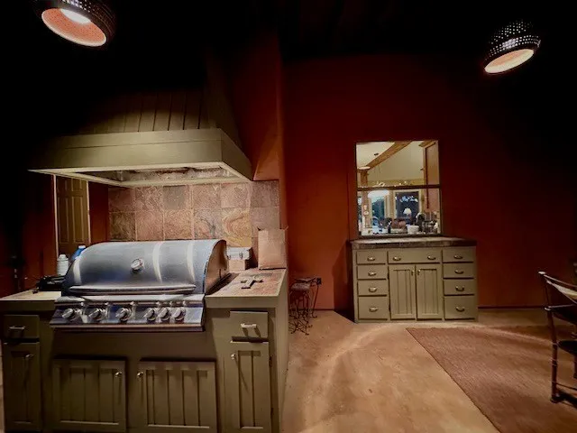 a kitchen with a stove and a cabinets