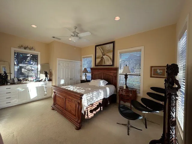 a backyard of a house with barbeque oven table and chairs