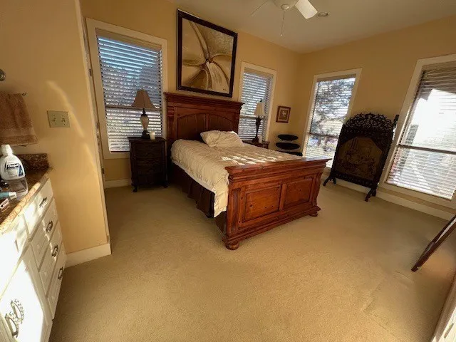 a view of a house with a yard and table