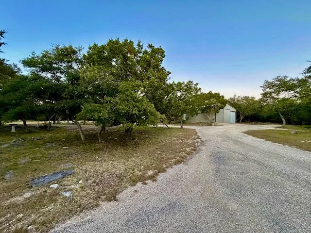a living room with lots of furniture and a chandelier