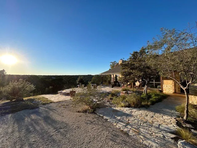 a kitchen with stainless steel appliances granite countertop a stove microwave and refrigerator