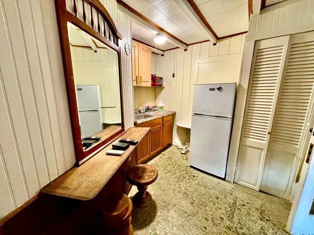 a bedroom with a bed and a table