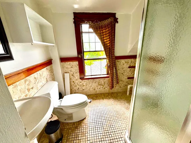 a bathroom with a sink and a toilet